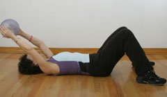 demonstrating exercise while lying on the floor